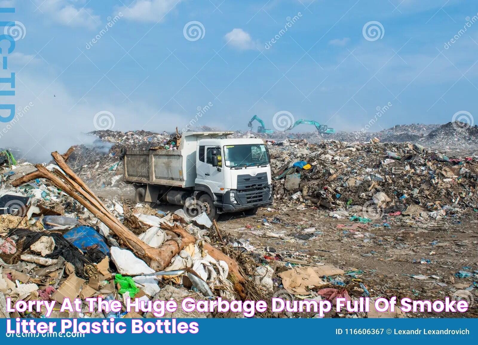 Lorry At The Huge Garbage Dump Full Of Smoke, Litter, Plastic Bottles